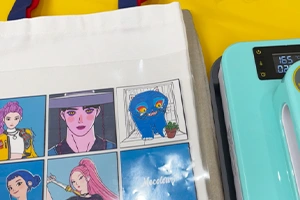 Place the printed design on the canvas bag